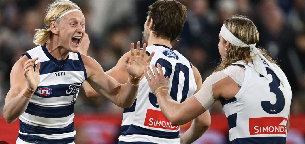 Players contest a pack mark in a tight AFL contest