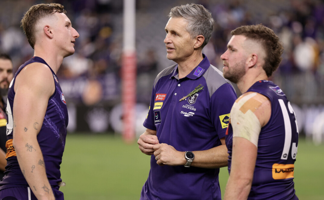 Fremantle coach Justin Longmuir with his players after another win — the Dockers sealed the minor premiership with a league-best defence